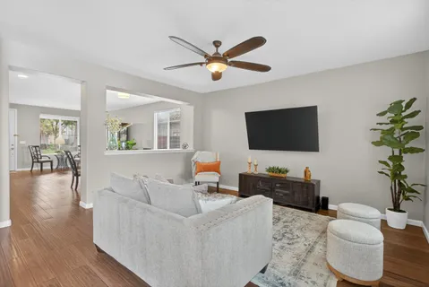 a living room with furniture and a flat screen tv