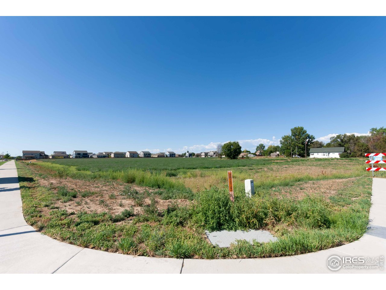 4th Avenue Severance, CO 80550 - Photo 7 of 12 a view of lake with green space