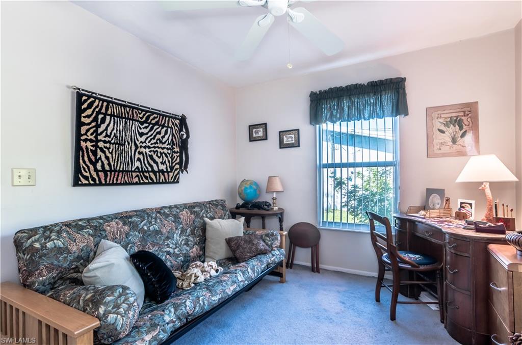 18565 Holly Road Fort Myers, FL 33967 - Photo 6 of 24 a living room with furniture and a window