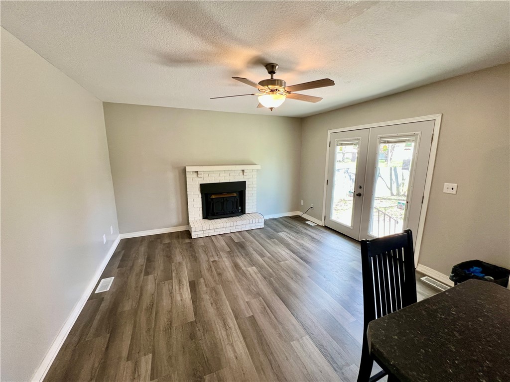 1272 South Lake Ridge Avenue Decatur, IL 62521 - Photo 7 of 20 wooden floor in an empty room with a window