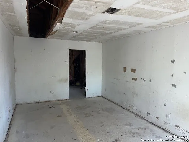 a backyard of a house with a shaded area