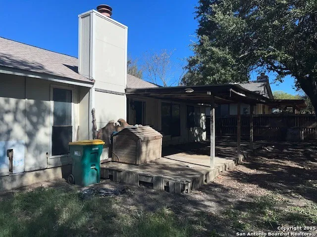 a view of a wooden door of the house