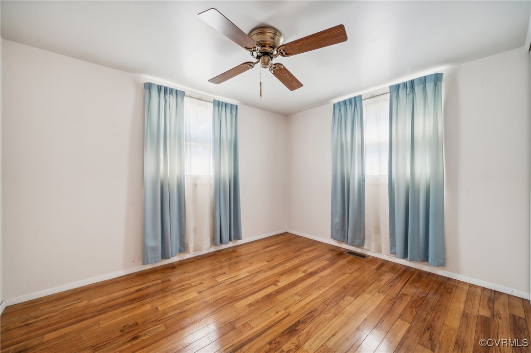 1409 Seward Drive Hampton, VA 23663 - Photo 17 of 35 a view of a livingroom with a ceiling fan and wooden floor