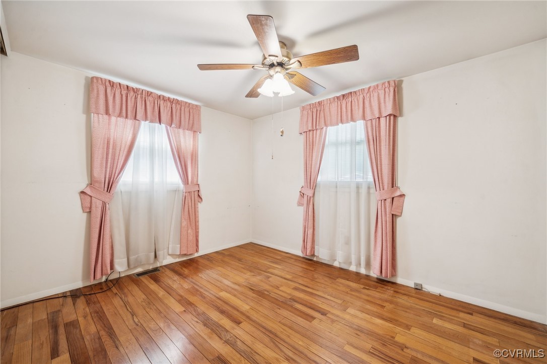 1409 Seward Drive Hampton, VA 23663 - Photo 19 of 35 a view of a room with wooden floor and white walls