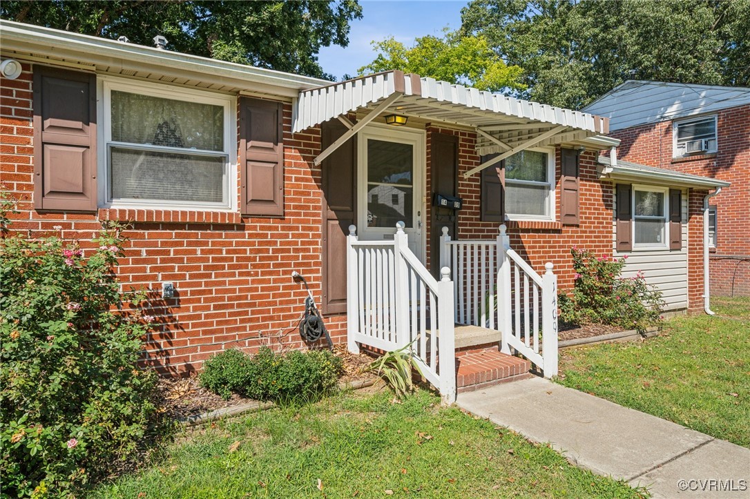 1409 Seward Drive Hampton, VA 23663 - Photo 2 of 35 a front view of a house with a yard