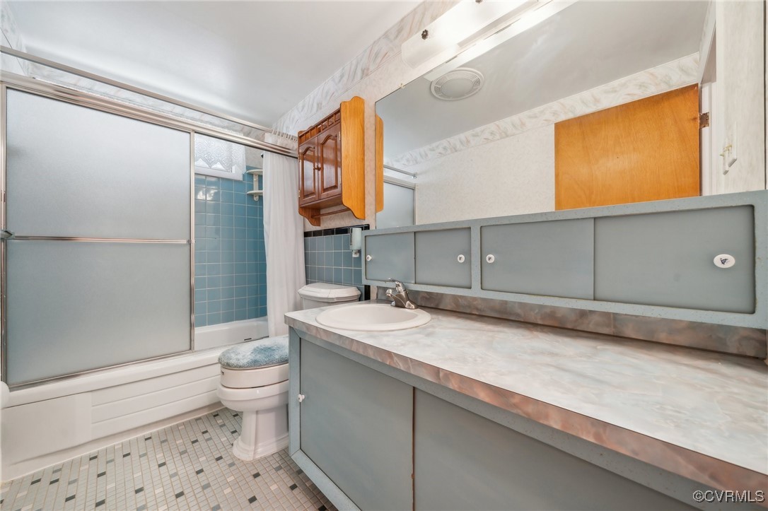 1409 Seward Drive Hampton, VA 23663 - Photo 21 of 35 a spacious bathroom with a granite countertop sink toilet and shower