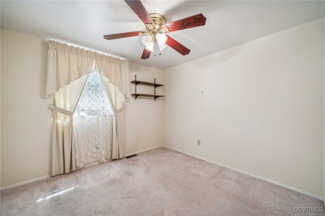 1409 Seward Drive Hampton, VA 23663 - Photo 22 of 35 an empty room with ceiling fan and entryway