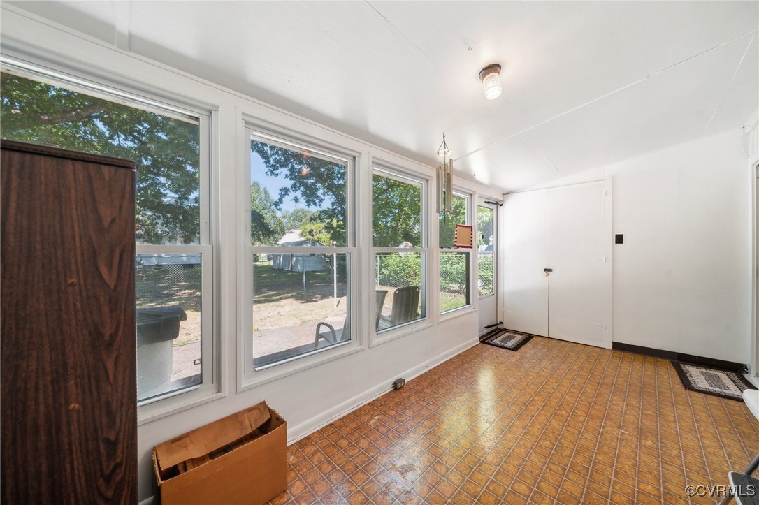1409 Seward Drive Hampton, VA 23663 - Photo 25 of 35 a view of an empty room with wooden floor and a window