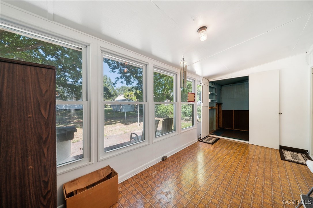1409 Seward Drive Hampton, VA 23663 - Photo 26 of 35 a view of an empty room with wooden floor and a window