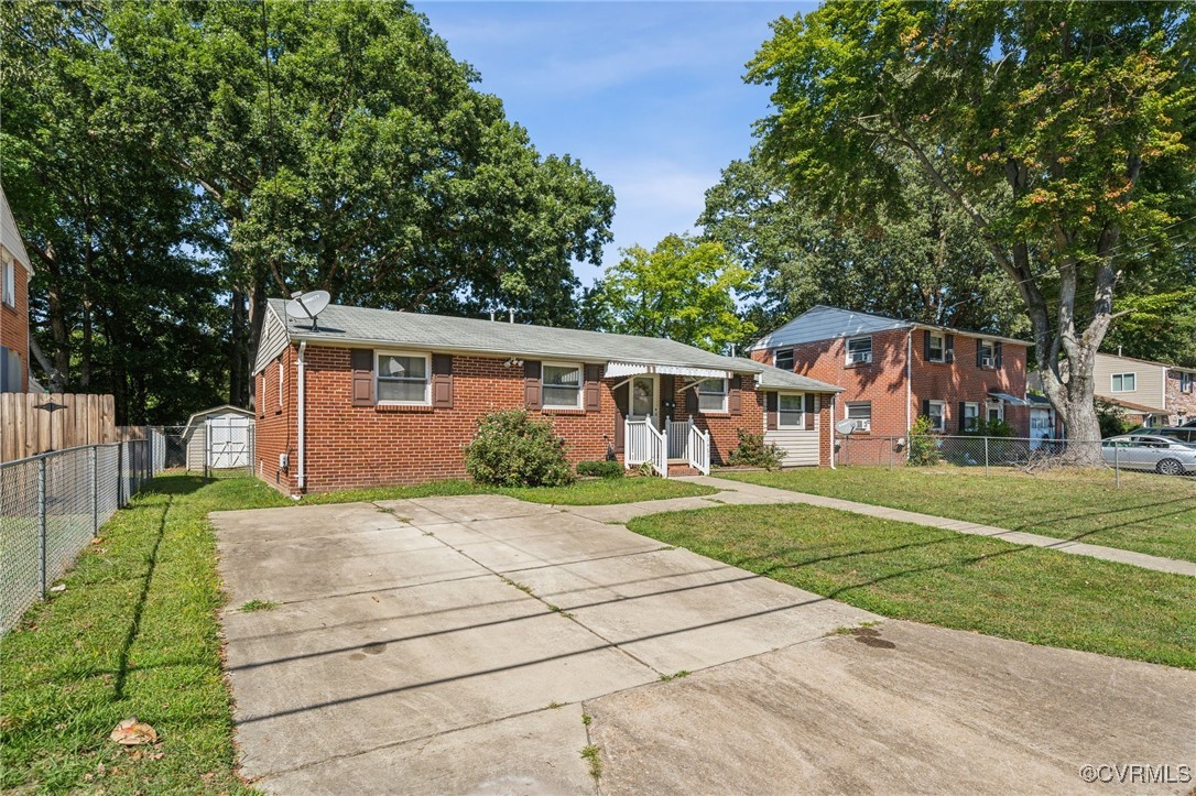 1409 Seward Drive Hampton, VA 23663 - Photo 34 of 35 a front view of a house with a yard