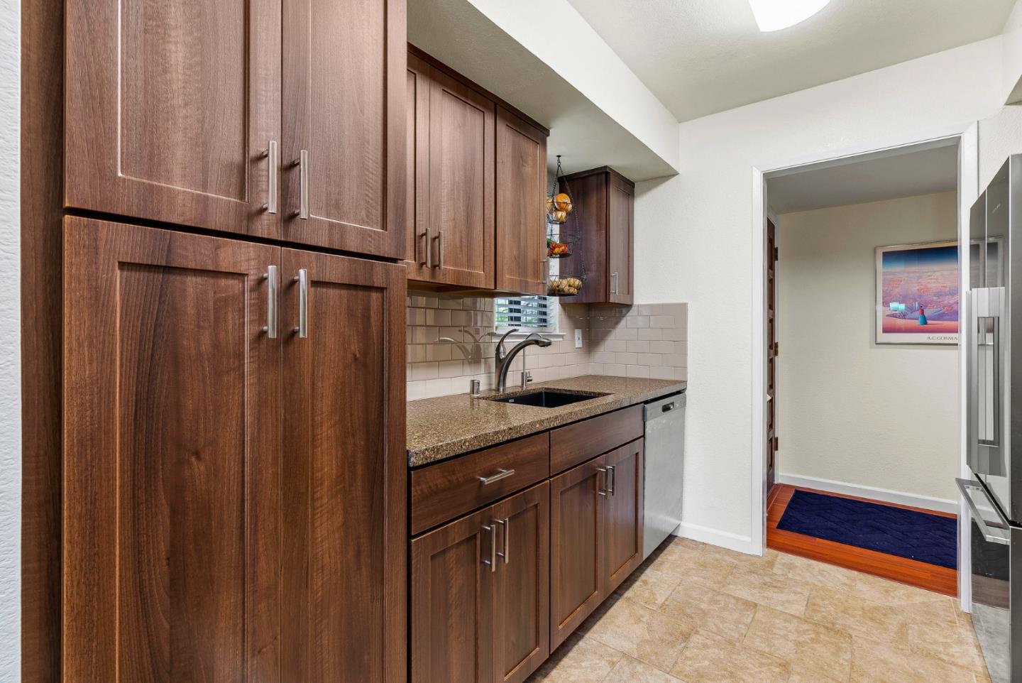 111 Bean Creek Road, Unit 115 Scotts Valley, CA 95066 - Photo 12 of 24 a kitchen with stainless steel appliances granite countertop a refrigerator and a sink