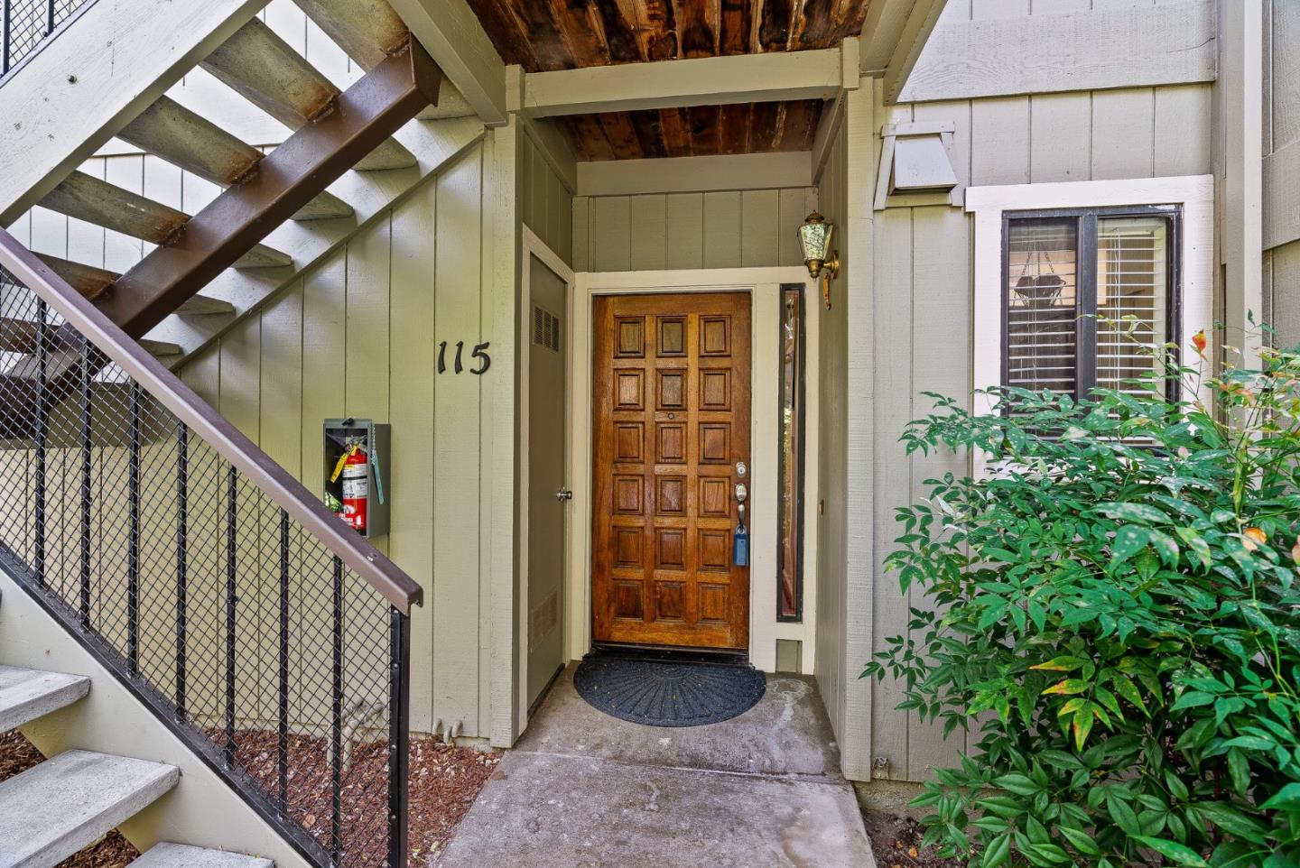 111 Bean Creek Road, Unit 115 Scotts Valley, CA 95066 - Photo 3 of 24 a view of a porch with wooden floor and stairs