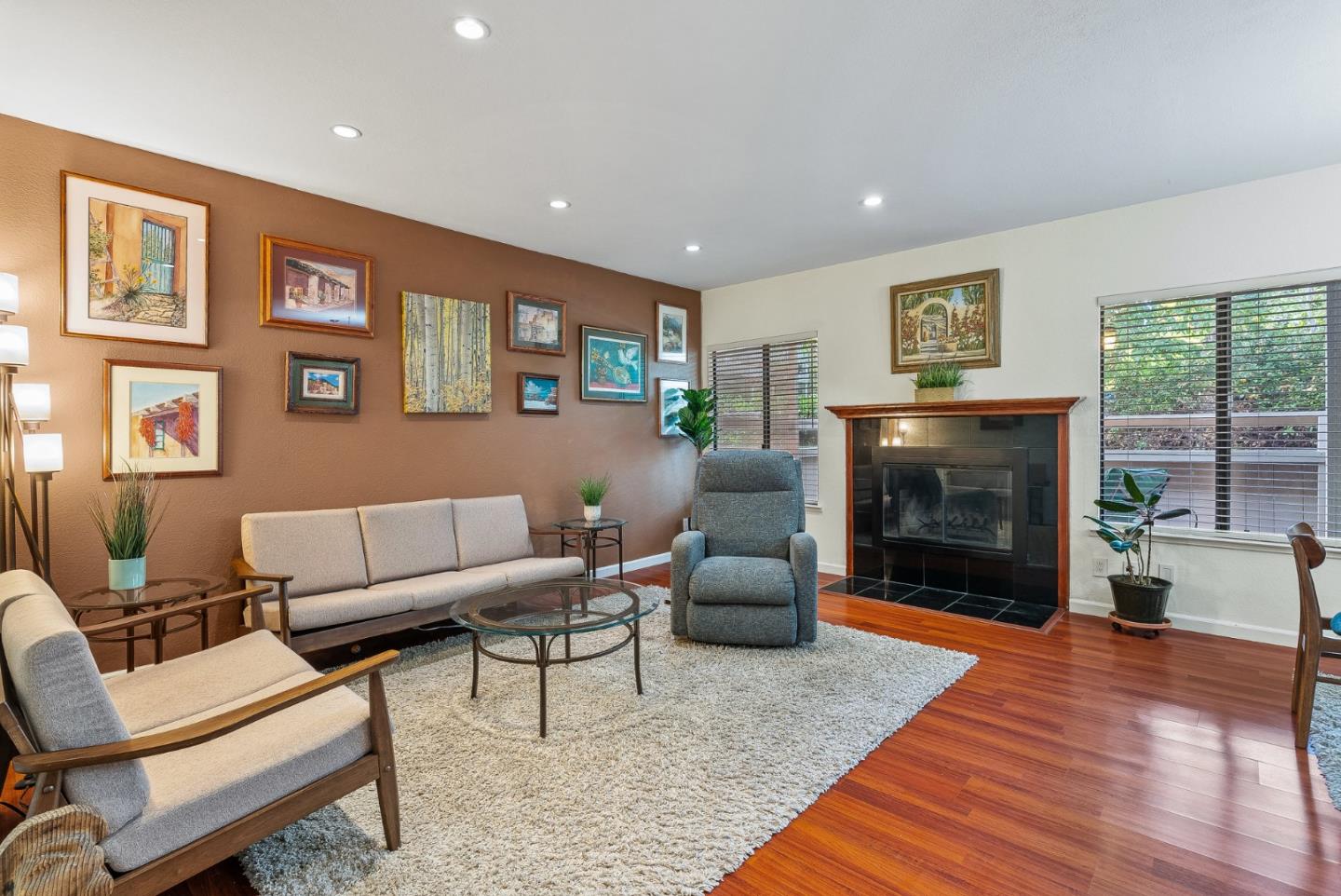 111 Bean Creek Road, Unit 115 Scotts Valley, CA 95066 - Photo 4 of 24 a living room with furniture a flat screen tv and a fireplace