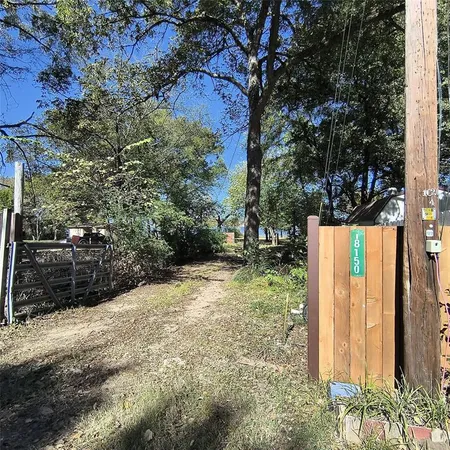 a view of a backyard of the house