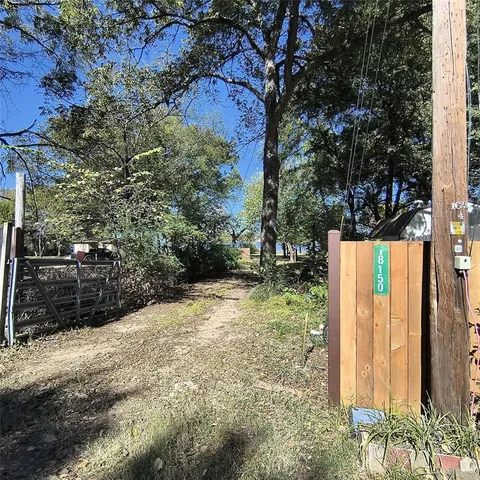 a view of a backyard of the house
