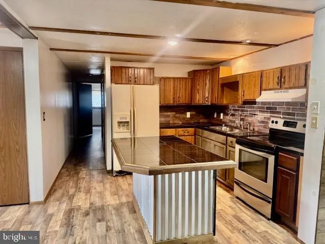 a bathroom with a bathtub and shower