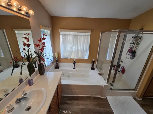 a bathroom with double vanity sink and mirror