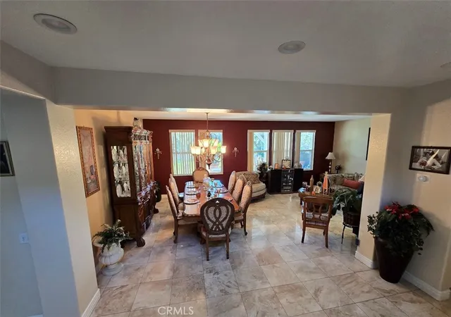 a living room with furniture and large windows