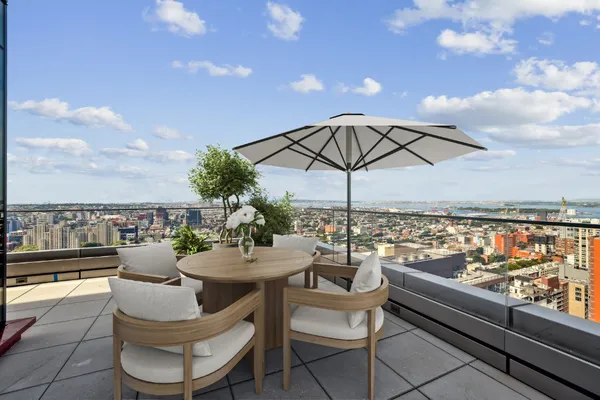 a view of a terrace with furniture and stove