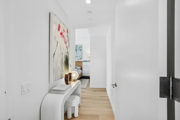 a view of a bedroom with a bed and a couch