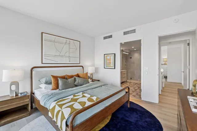 a bedroom with bed and a window