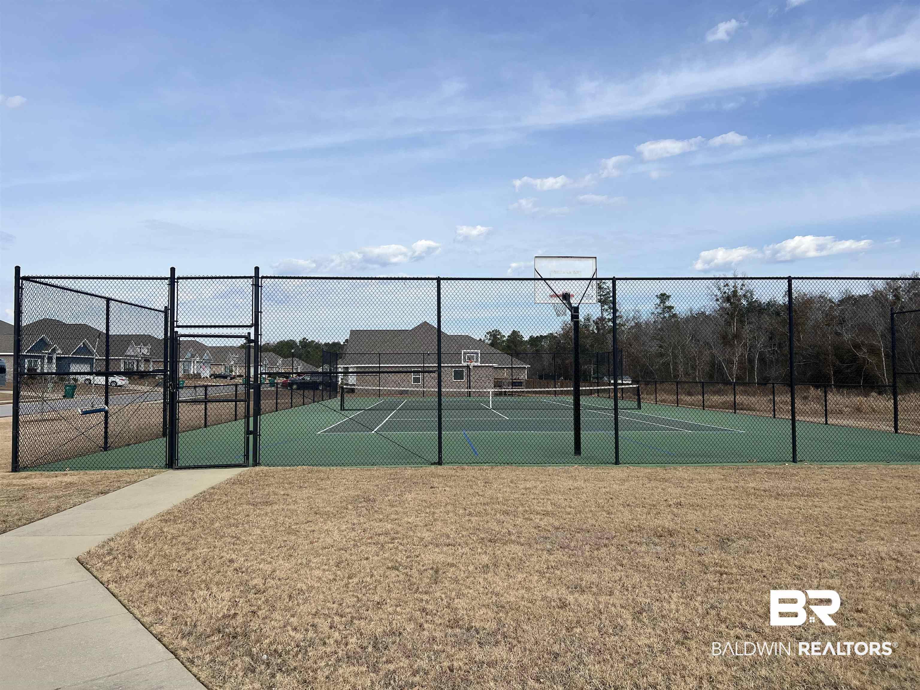 8855 Calverton Street Foley, AL 36535 - Photo 74 of 76 View of tennis court with a yard