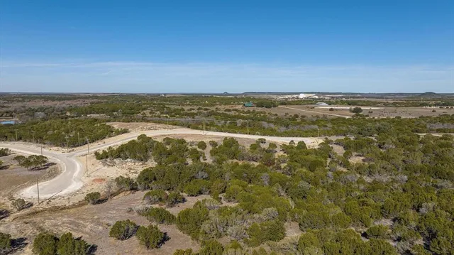 an aerial view of residential building and parking space