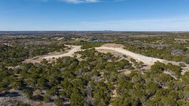 an aerial view of a house with a ocean view