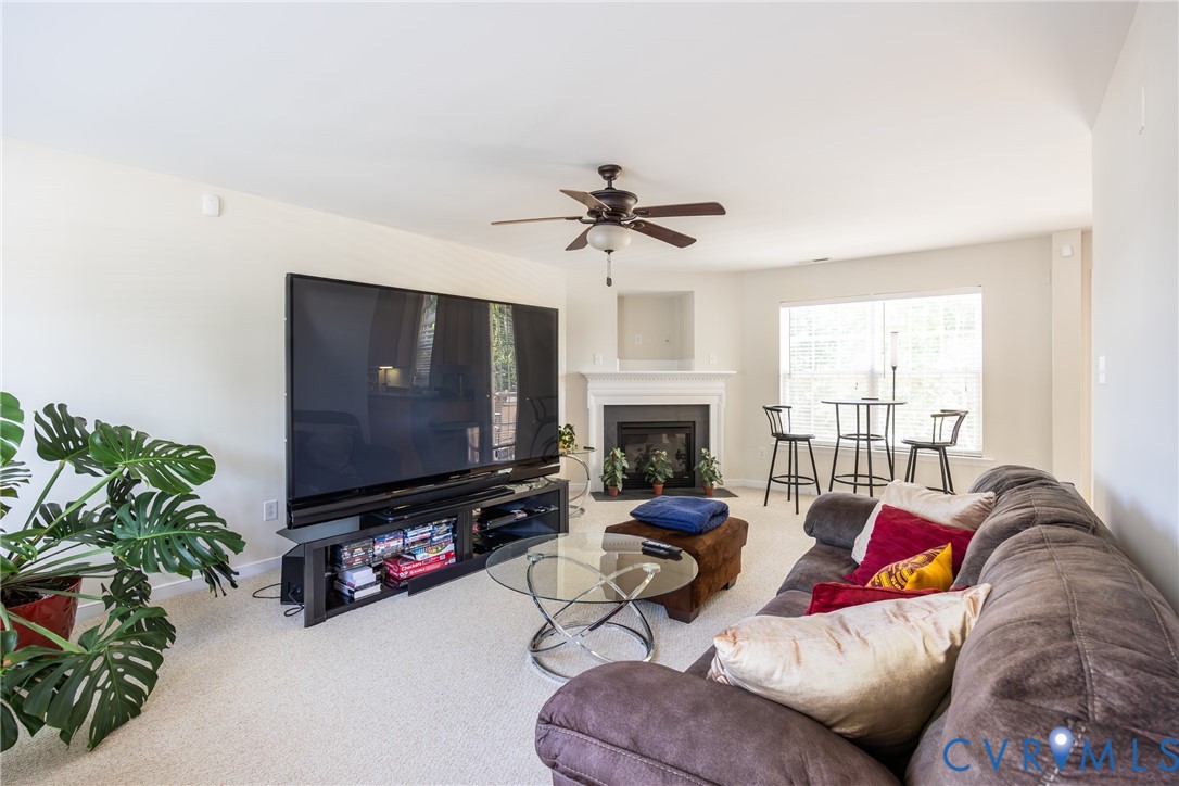 2928 Heather Ridge Drive Henrico, VA 23231 - Photo 10 of 34 Carpeted living area featuring a built-in fireplac