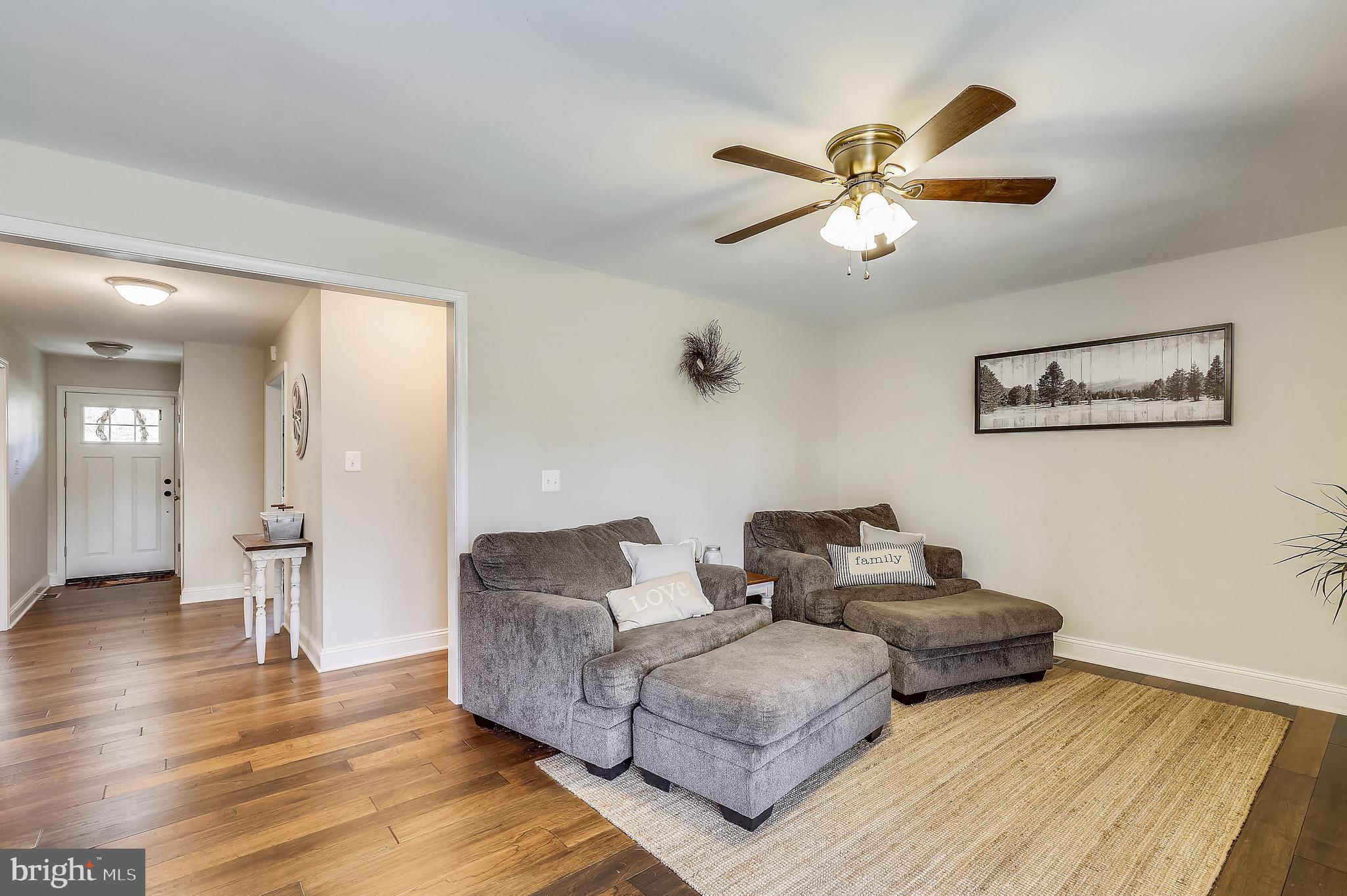 9426 Boyds Turn Road Owings, MD 20736 - Photo 6 of 27 a living room with couches and a view of kitchen