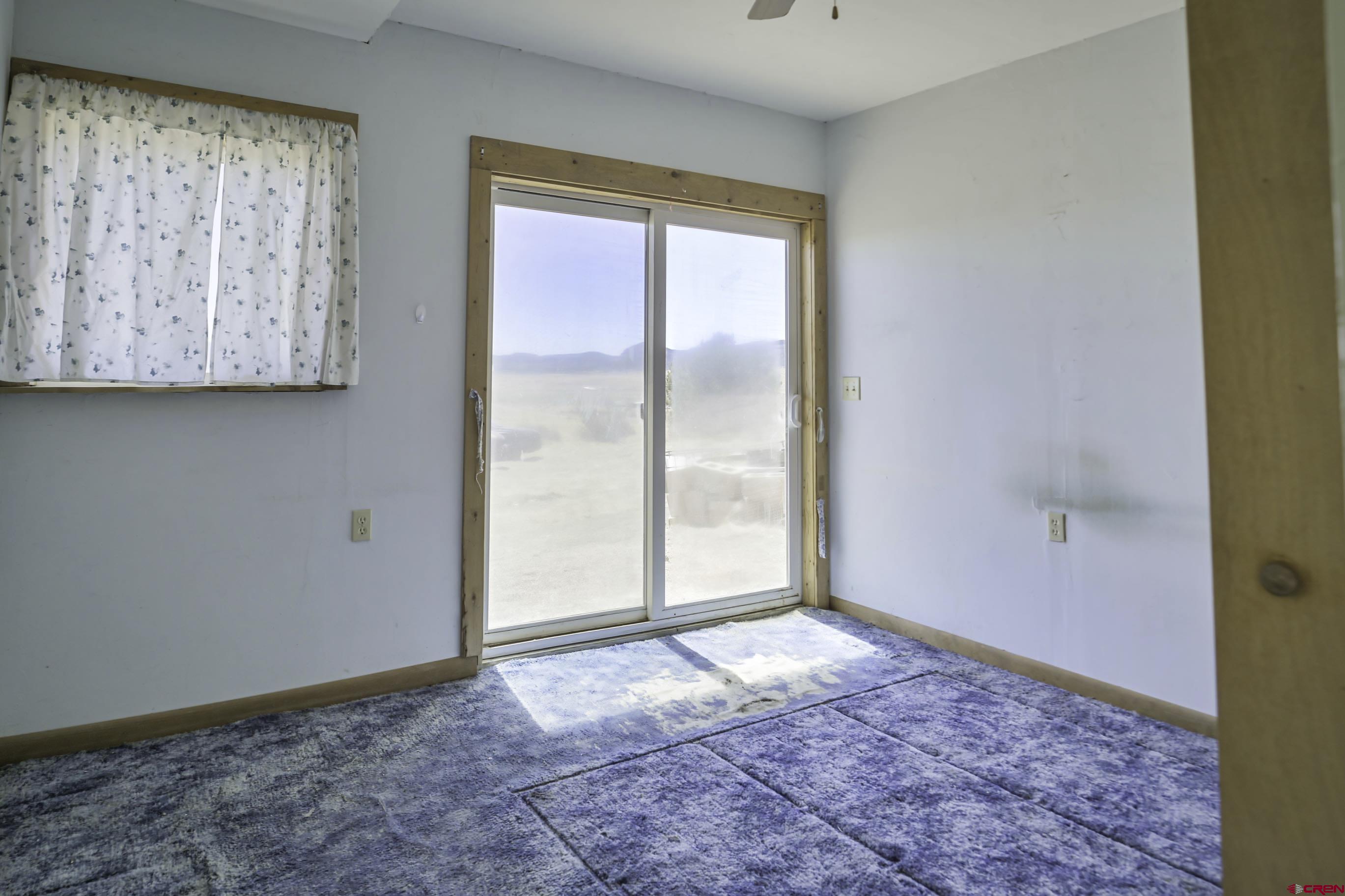 23500 Ridge Road Trinidad, CO 81082 - Photo 15 of 42 a view of an empty room with window and closet