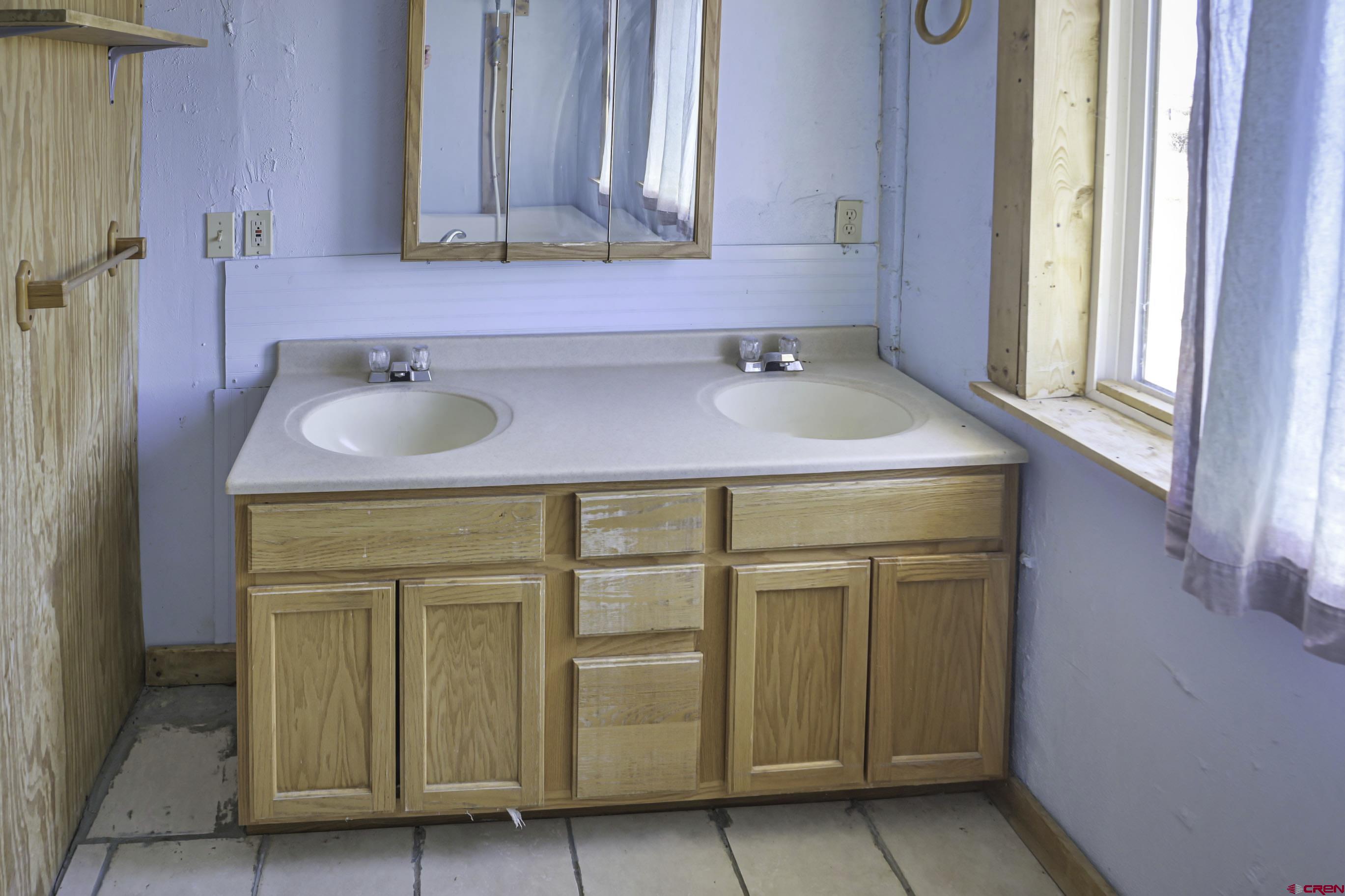 23500 Ridge Road Trinidad, CO 81082 - Photo 18 of 42 a bathroom with a sink and a mirror