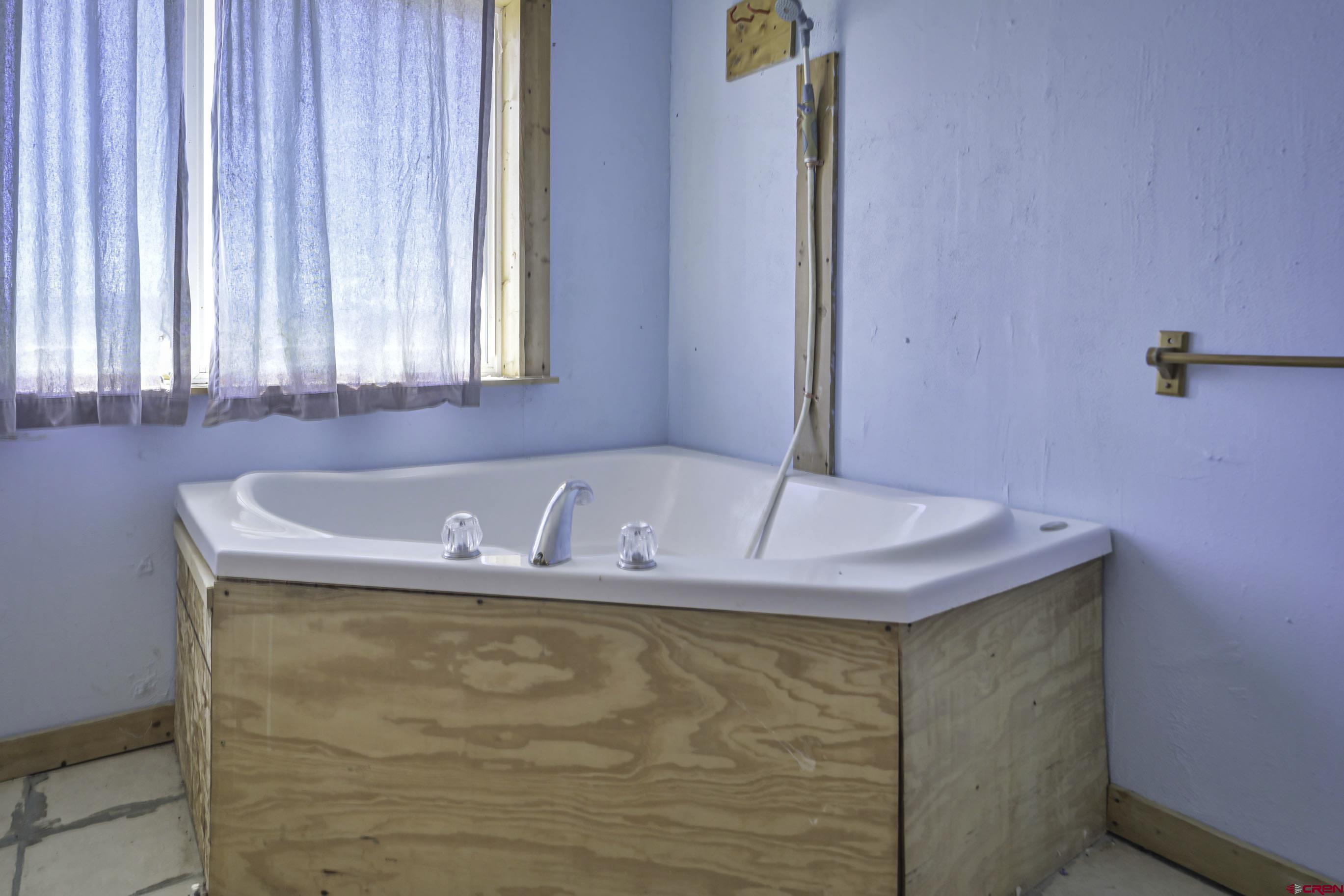 23500 Ridge Road Trinidad, CO 81082 - Photo 19 of 42 a bath tub sitting in a bathroom