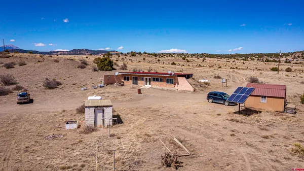 an aerial view of a backyard of a house