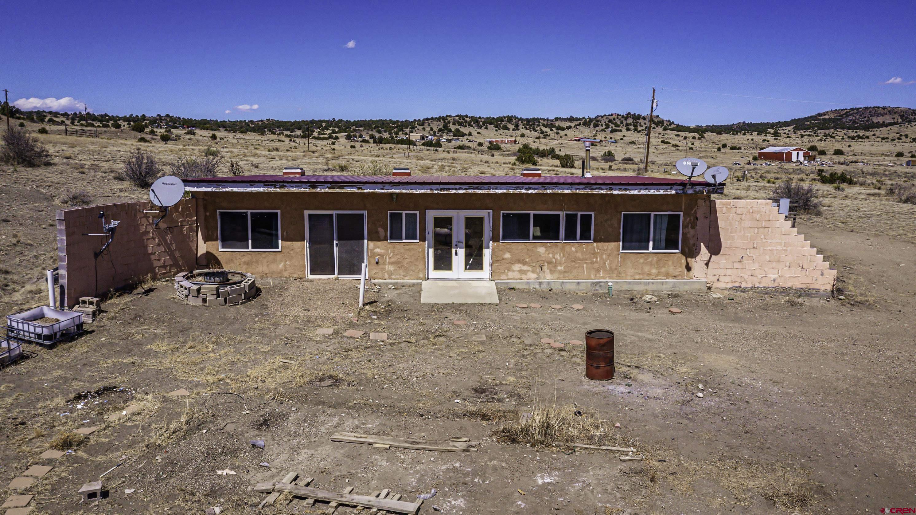 23500 Ridge Road Trinidad, CO 81082 - Photo 6 of 42 a view of a house with a backyard