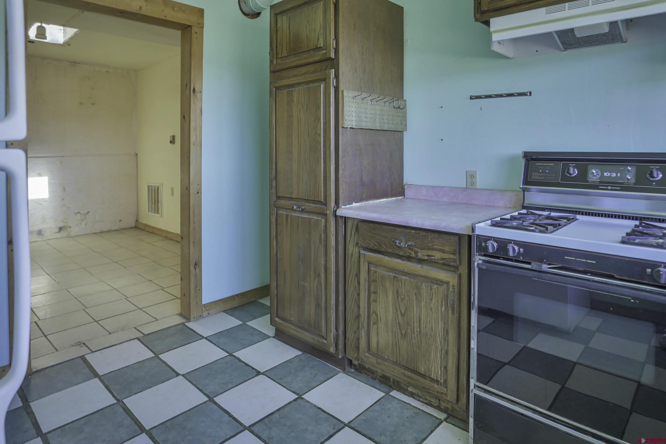 23500 Ridge Road Trinidad, CO 81082 - Photo 10 of 42 a kitchen with a stove and a cabinets