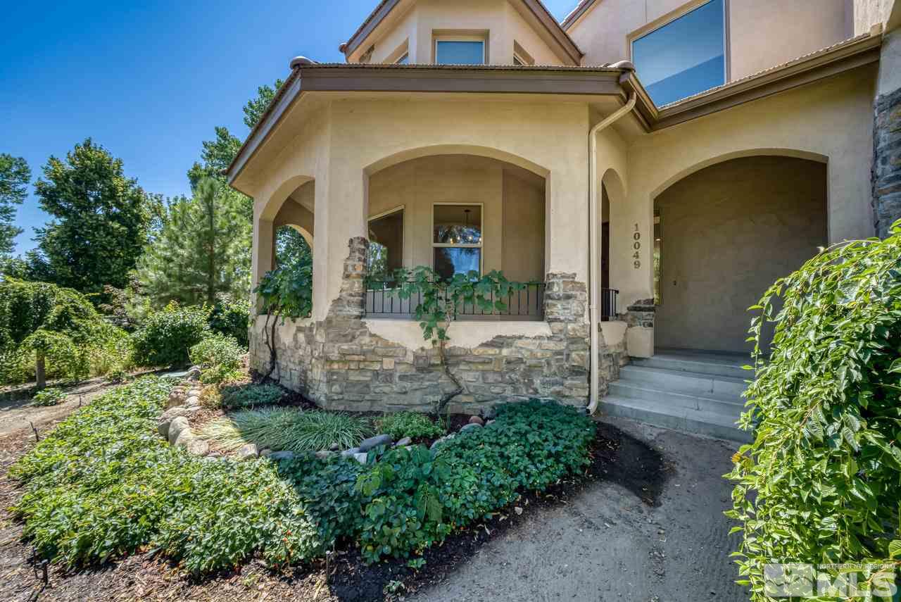 10049 Casazza Ranch Lane Reno, NV 89511 - Photo 3 of 40 a front view of a house with garden