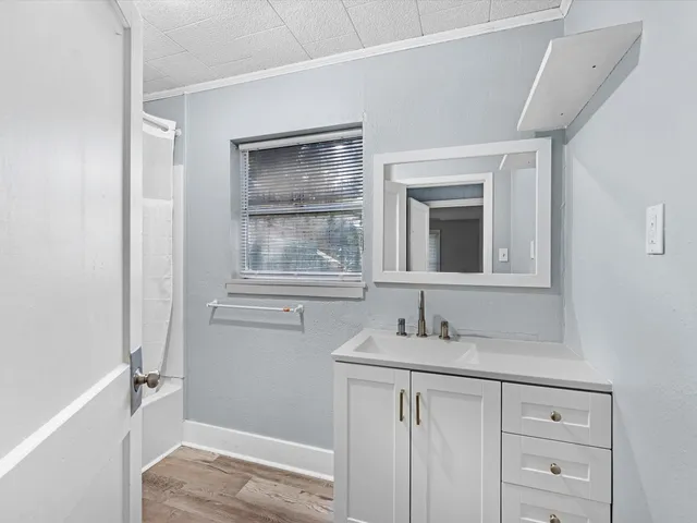 a bathroom with a sink and a mirror