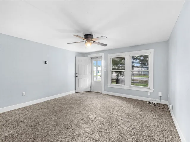 a kitchen with granite countertop white cabinets white stainless steel appliances with a sink and dishwasher