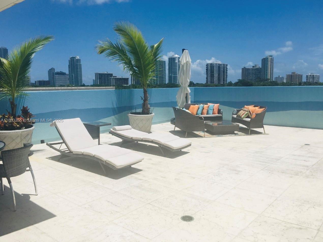2701 Southwest 3rd Avenue, Unit 201 Miami, FL 33129 - Photo 15 of 16 a view of swimming pool with outdoor seating and plants