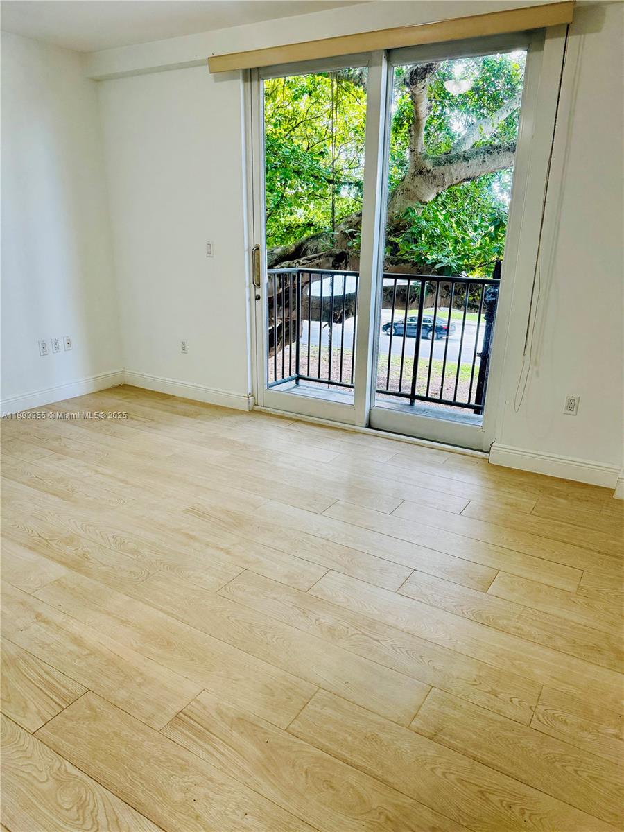 2701 Southwest 3rd Avenue, Unit 201 Miami, FL 33129 - Photo 4 of 16 a view of an empty room with a window