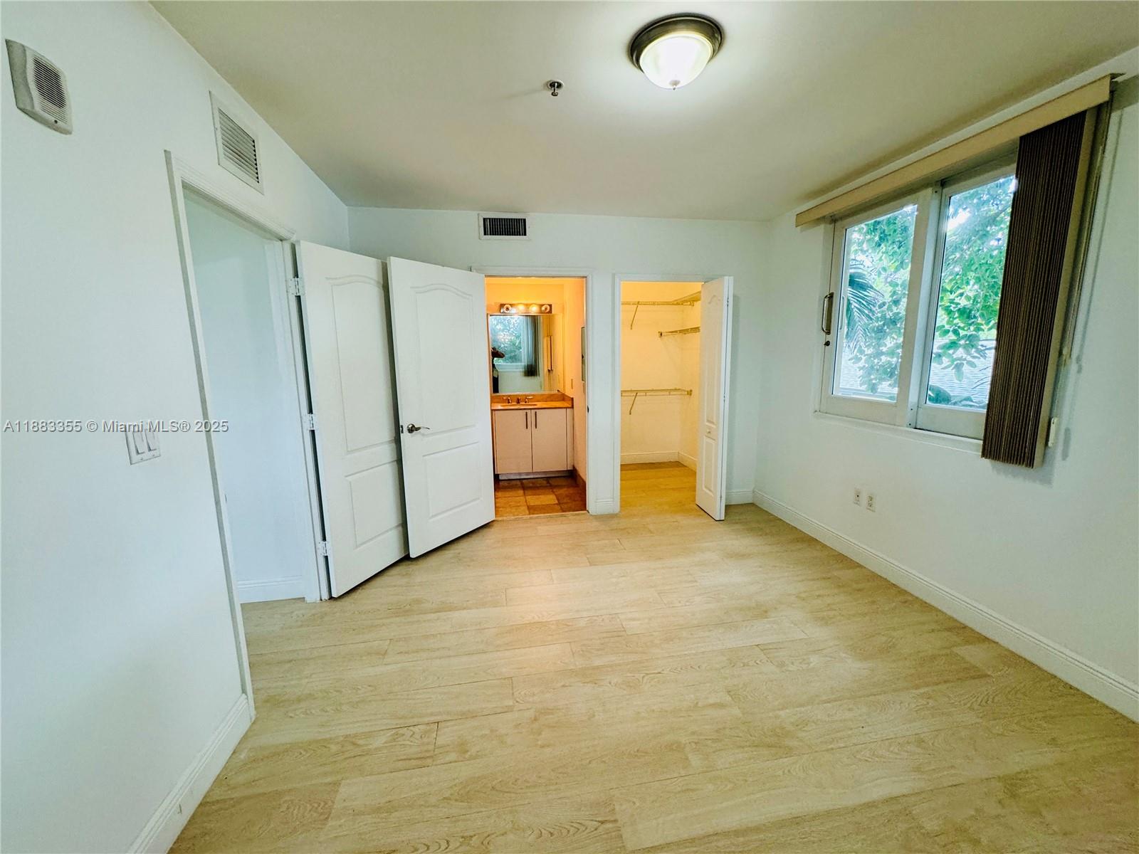 2701 Southwest 3rd Avenue, Unit 201 Miami, FL 33129 - Photo 5 of 16 a view of an empty room with a window