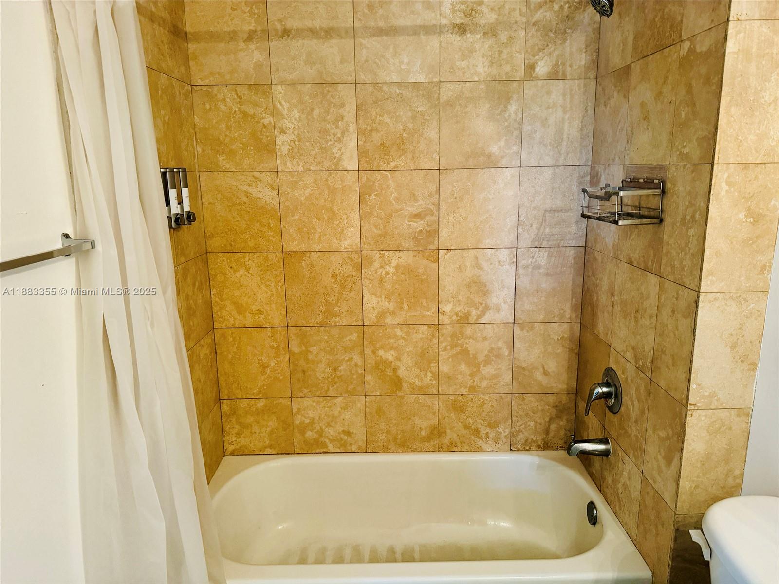 2701 Southwest 3rd Avenue, Unit 201 Miami, FL 33129 - Photo 6 of 16 a bathroom with a bathtub