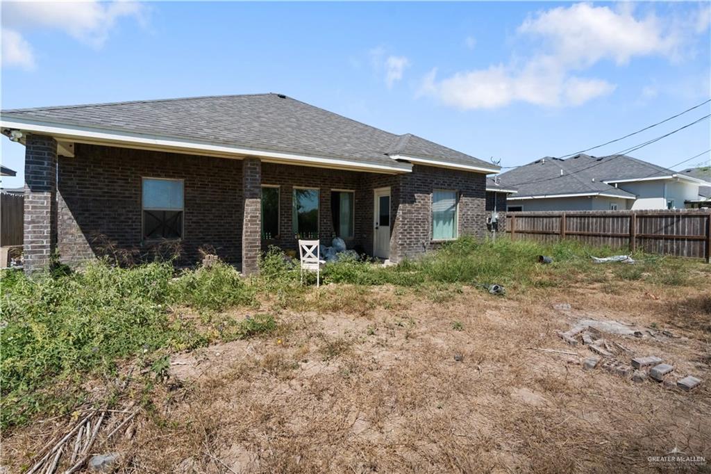 822 Whitewing Street Alamo, TX 78516 - Photo 11 of 11 a front view of a house with garden