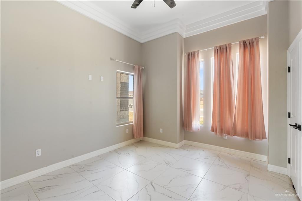 822 Whitewing Street Alamo, TX 78516 - Photo 5 of 11 a view of an empty room with a window