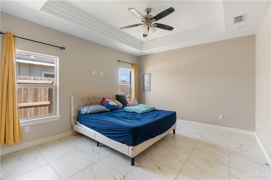 822 Whitewing Street Alamo, TX 78516 - Photo 6 of 11 a bed room with a bed and a window