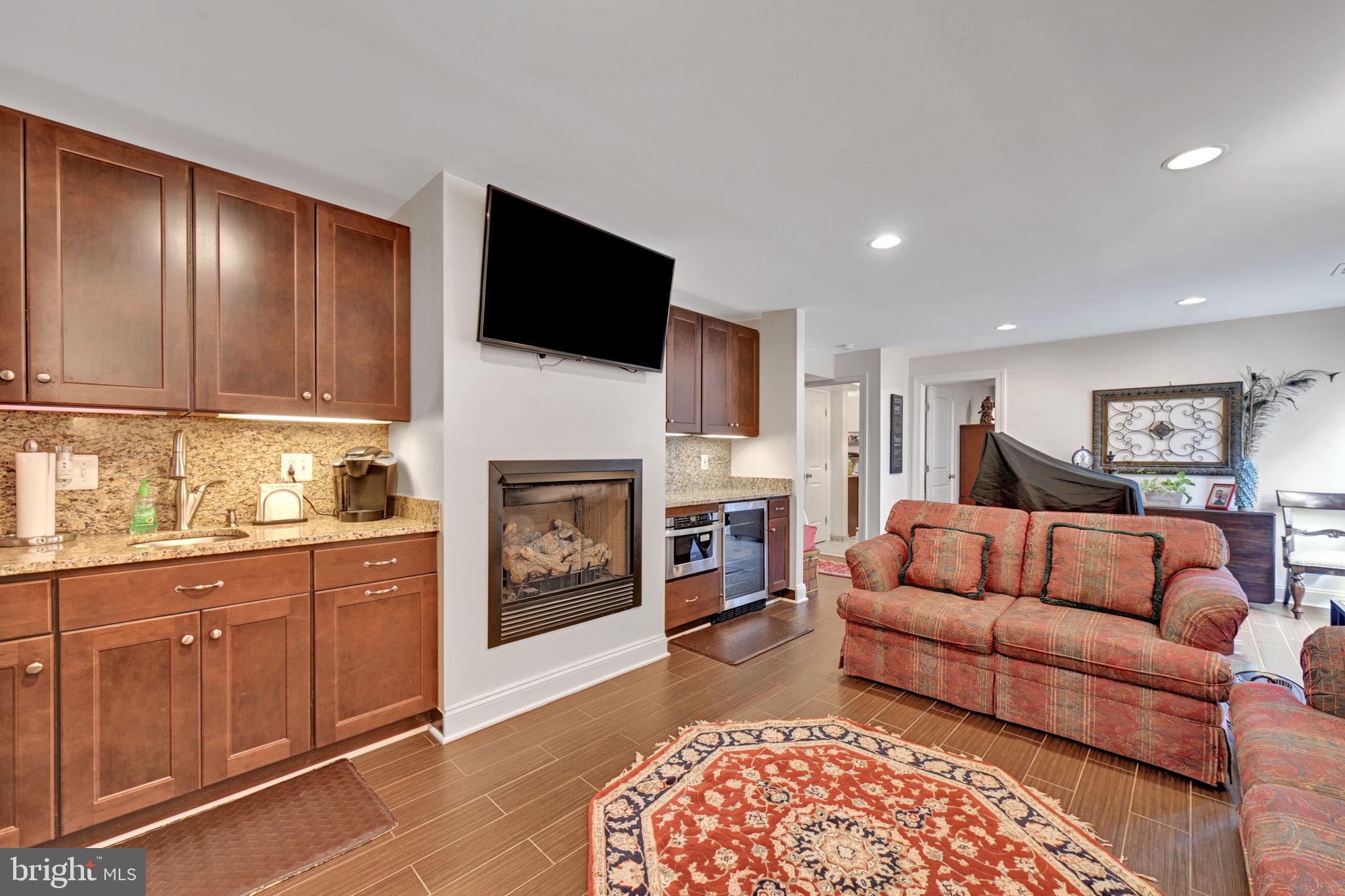 6200 Hanover Avenue Springfield, VA 22150 - Photo 73 of 87 Rec Room with Kitchenette and Gas Fireplace