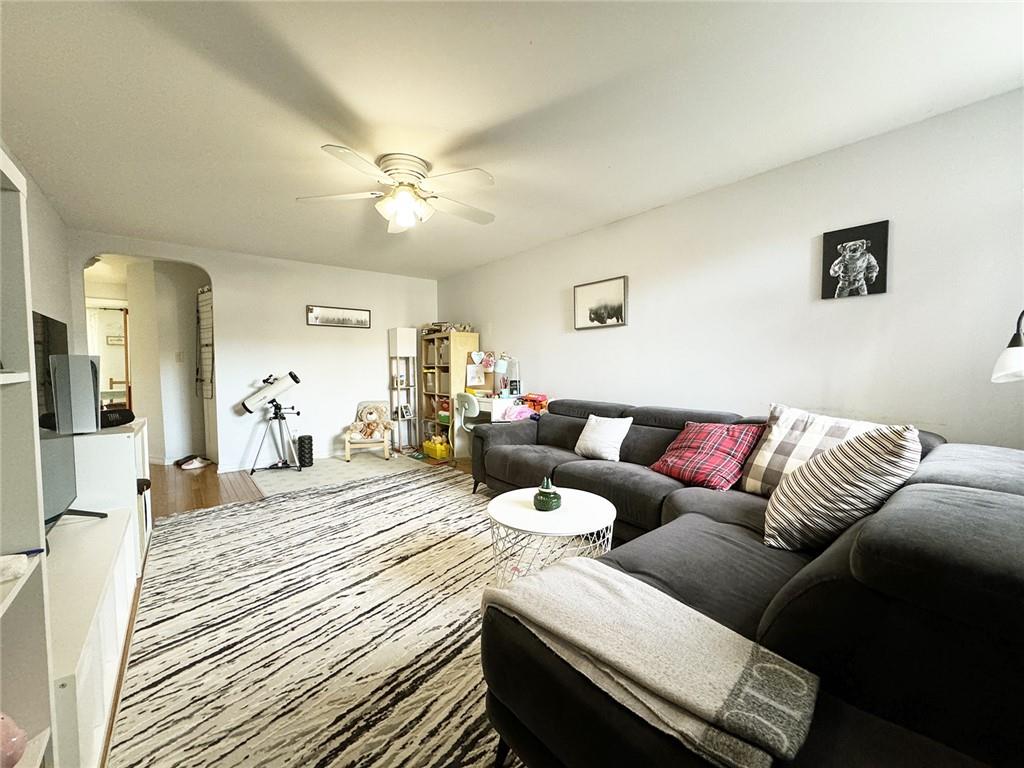249 Bay 22nd Street Brooklyn, NY 11214 - Photo 2 of 12 a living room with furniture and a wooden floor