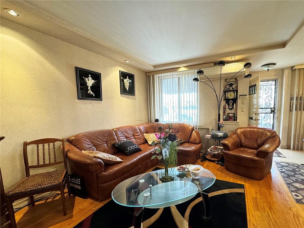 249 Bay 22nd Street Brooklyn, NY 11214 - Photo 4 of 12 a living room with furniture and a window