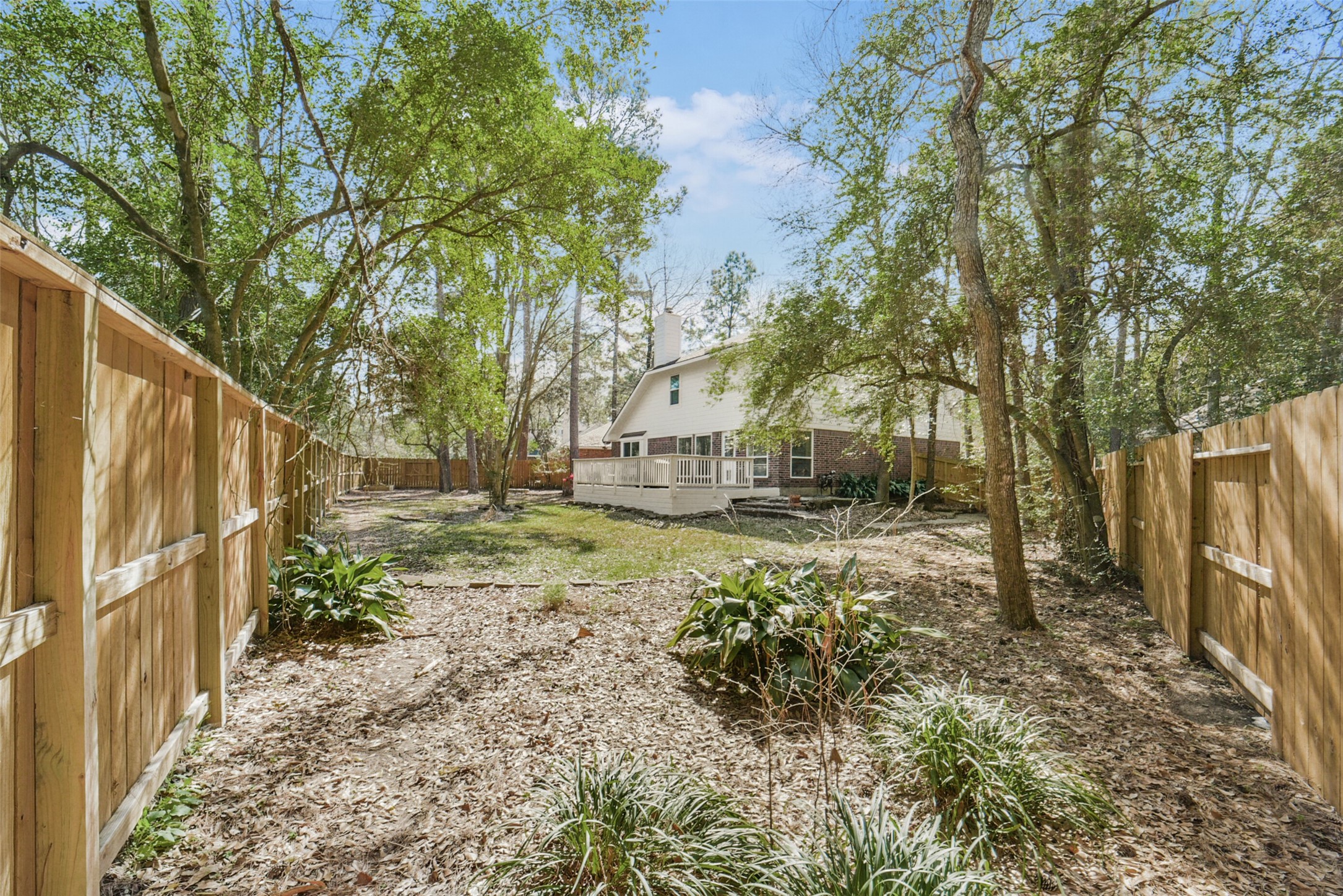 38 Tallow Hill Place Spring, TX 77382 - Photo 44 of 50 a view of a yard with wooden fence